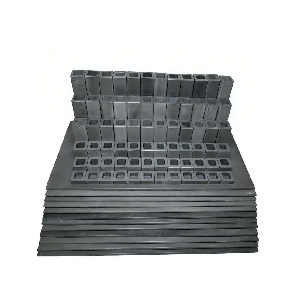 An 84-piece L&L T2336 DaVinci ceramic kiln accessory kit systematically arranged, featuring high-temperature kiln posts and shelves designed for optimized stack-firing in professional pottery and ceramic kilns.
